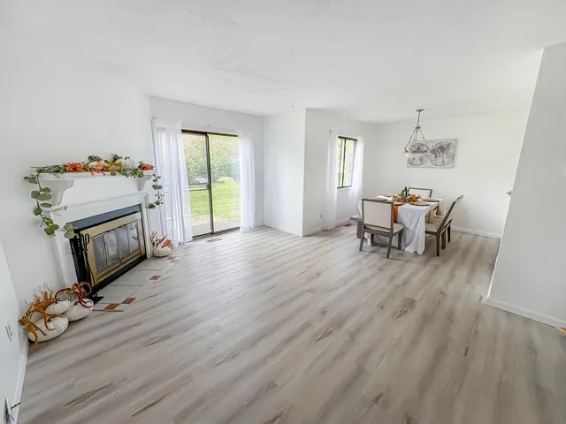 a view of a livingroom with furniture and a flat screen tv