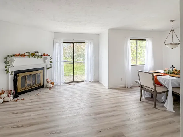 a view of a livingroom with furniture and a fireplace