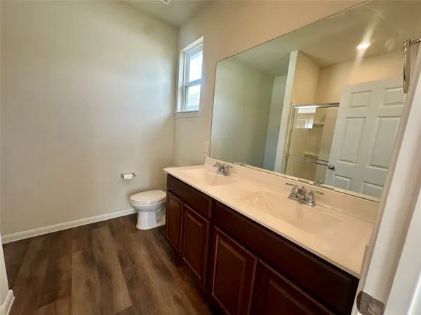 a bathroom with a sink a mirror and a shower