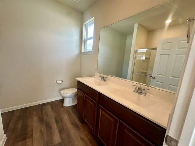 a bathroom with a sink a mirror and a shower