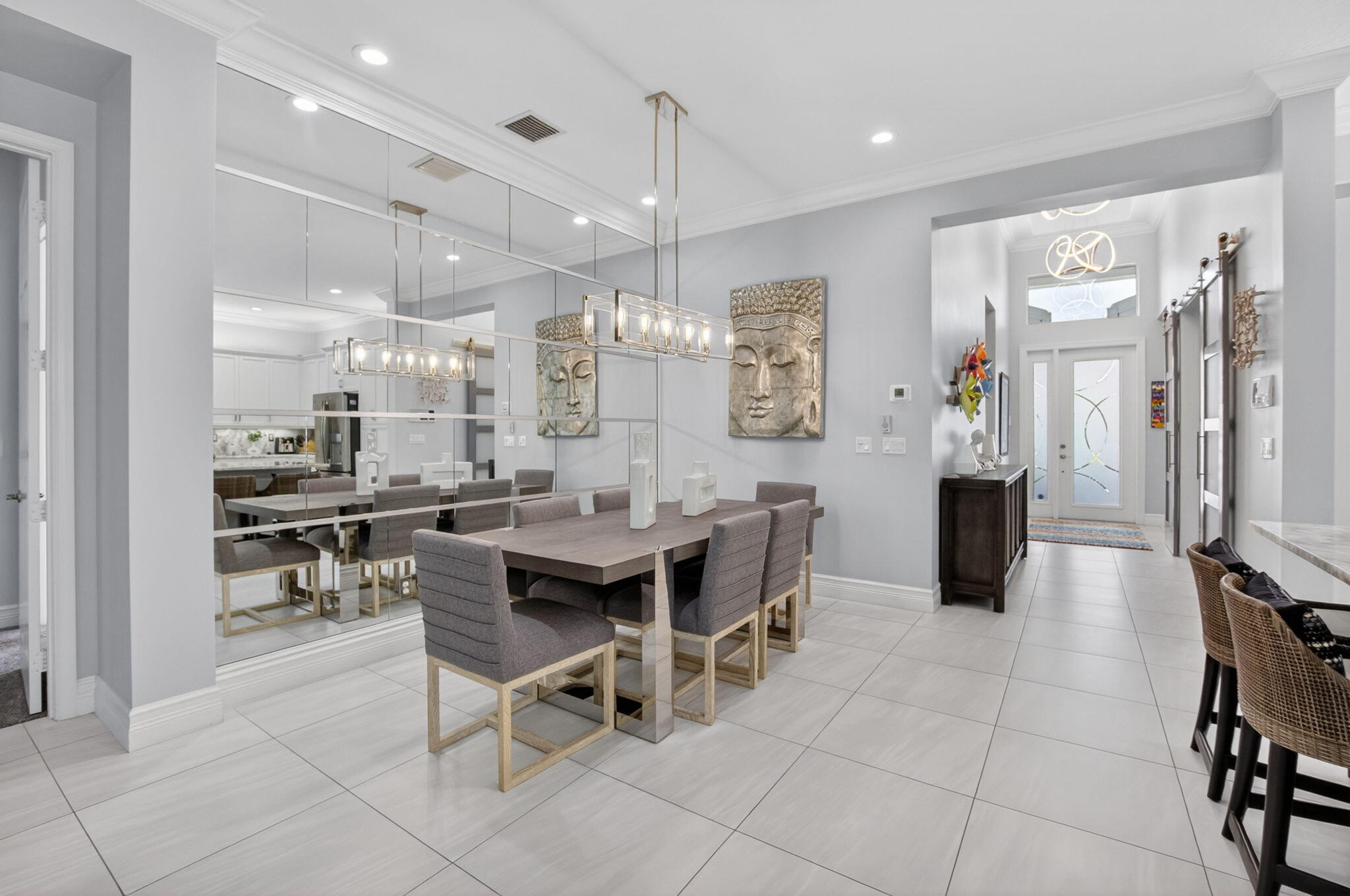 8263 Arabian Range Road Boynton Beach, FL 33473 - Photo 13 of 52 a kitchen with stainless steel appliances kitchen island granite countertop a table and chairs in it