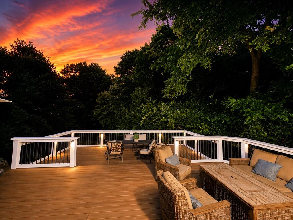 7204 Montgomery Road Midlothian, TX 76065 - Photo 7 of 32 Expansive wood-finish deck with white railings and black balusters