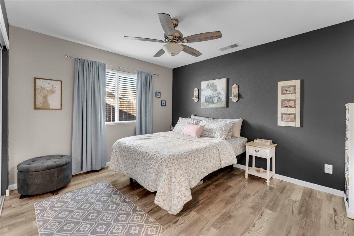 2110 Gentry Way Red Bluff, CA 96080 - Photo 16 of 47 a bedroom with a bed and a couch