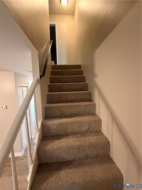 4605 Cogbill Road Richmond, VA 23234 - Photo 11 of 20 Carpeted staircase featuring a light-colored raili
