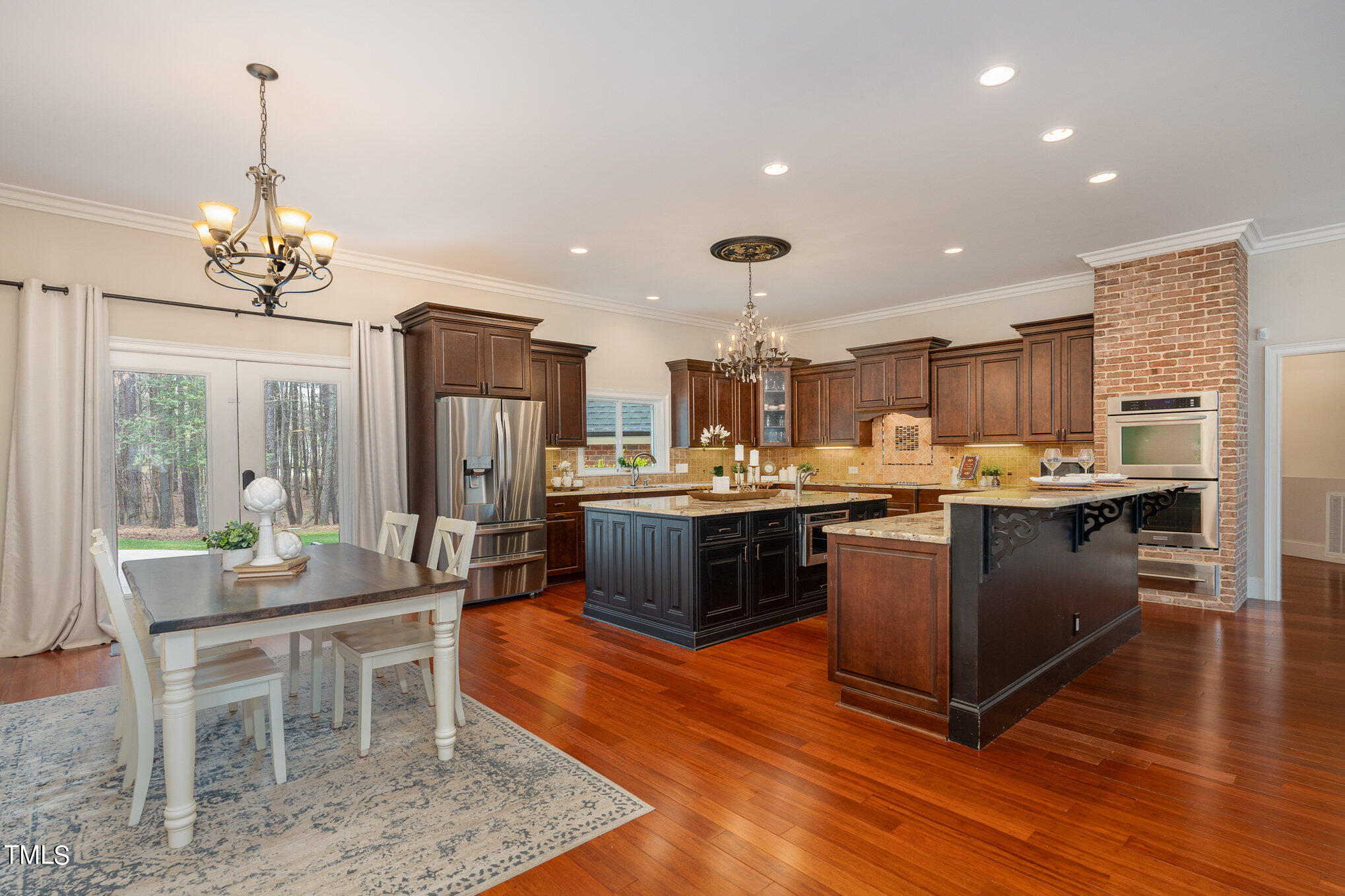 8404 Smith Road Apex, NC 27539 - Photo 4 of 19 Easy flow from the kitchen to the breakfast nook for an open concept space