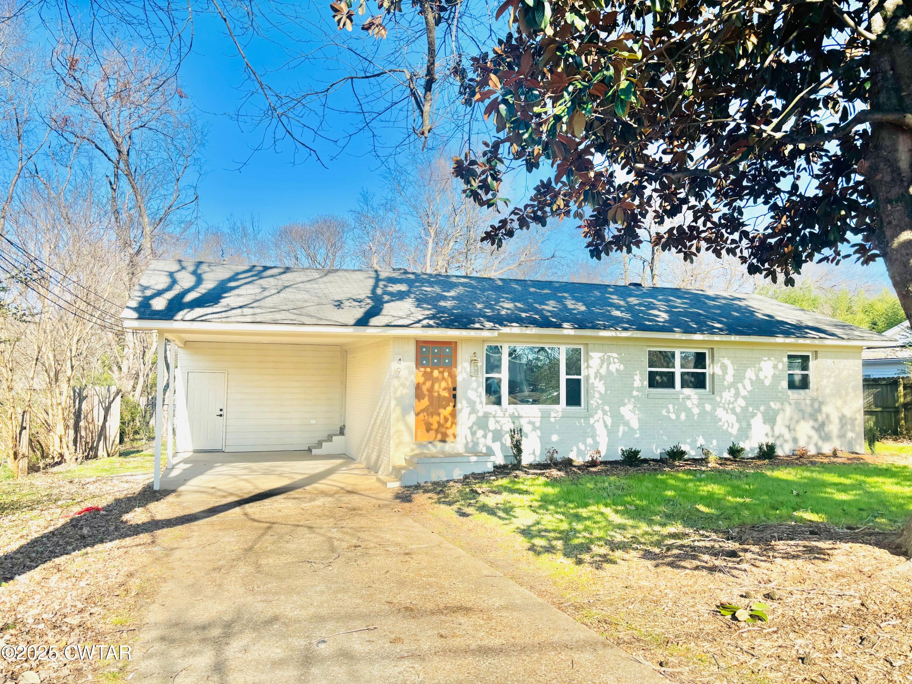 front view of a house with a yard