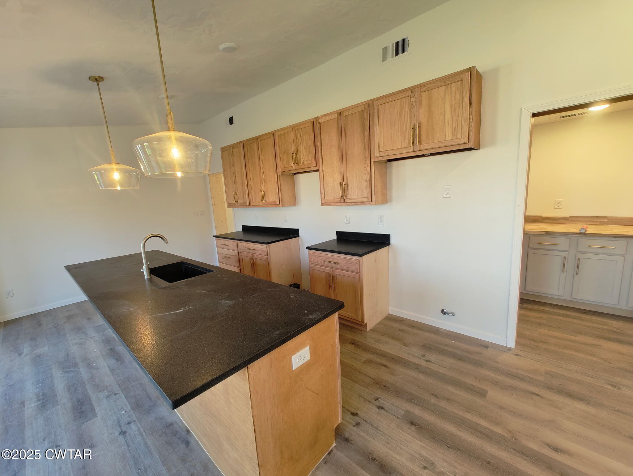 49 Primrose Drive Jackson, TN 38305 - Photo 11 of 20 a kitchen with stainless steel appliances granite countertop a sink a stove and a refrigerator