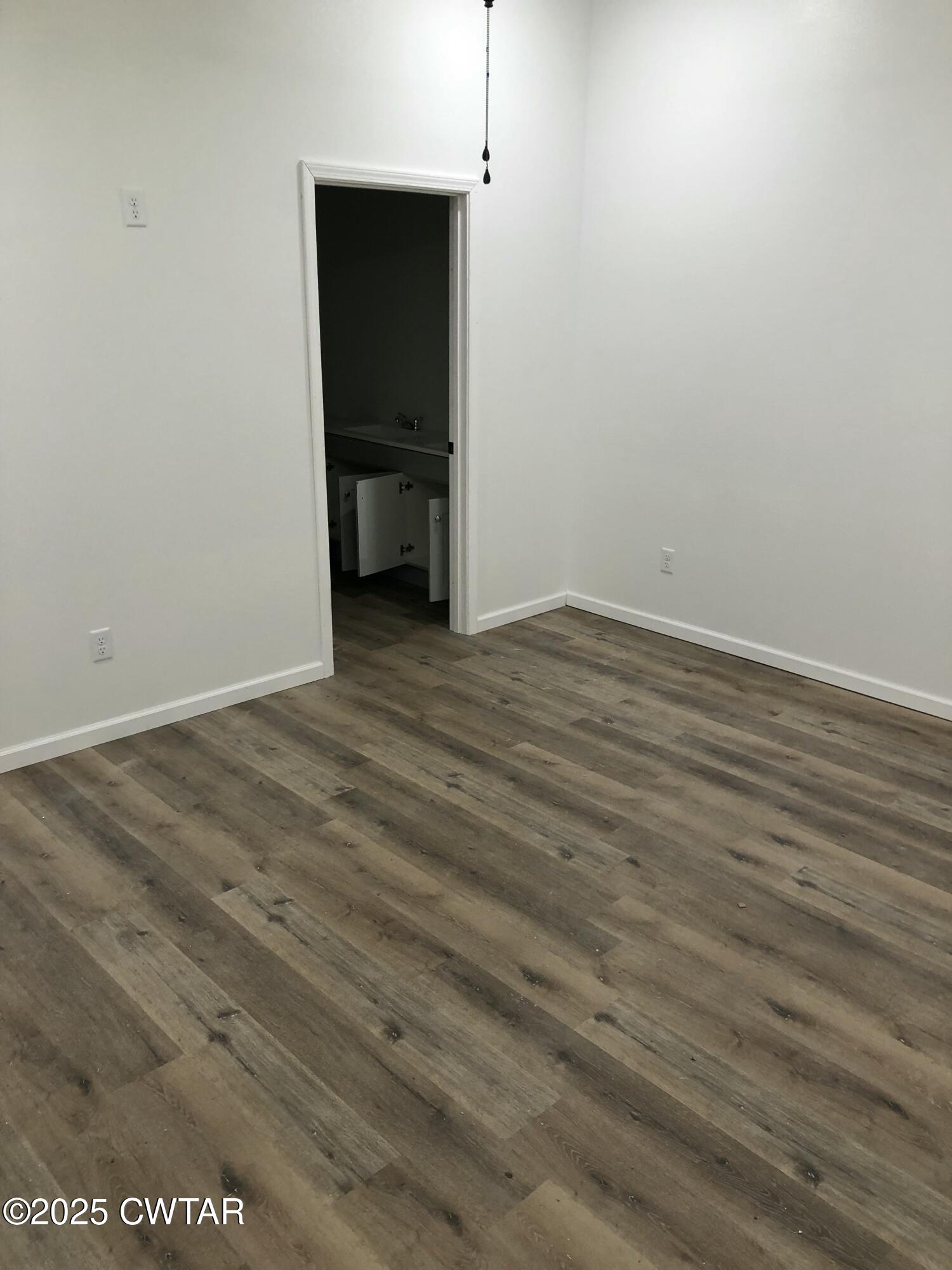 49 Primrose Drive Jackson, TN 38305 - Photo 17 of 20 a view of empty room with wooden floor