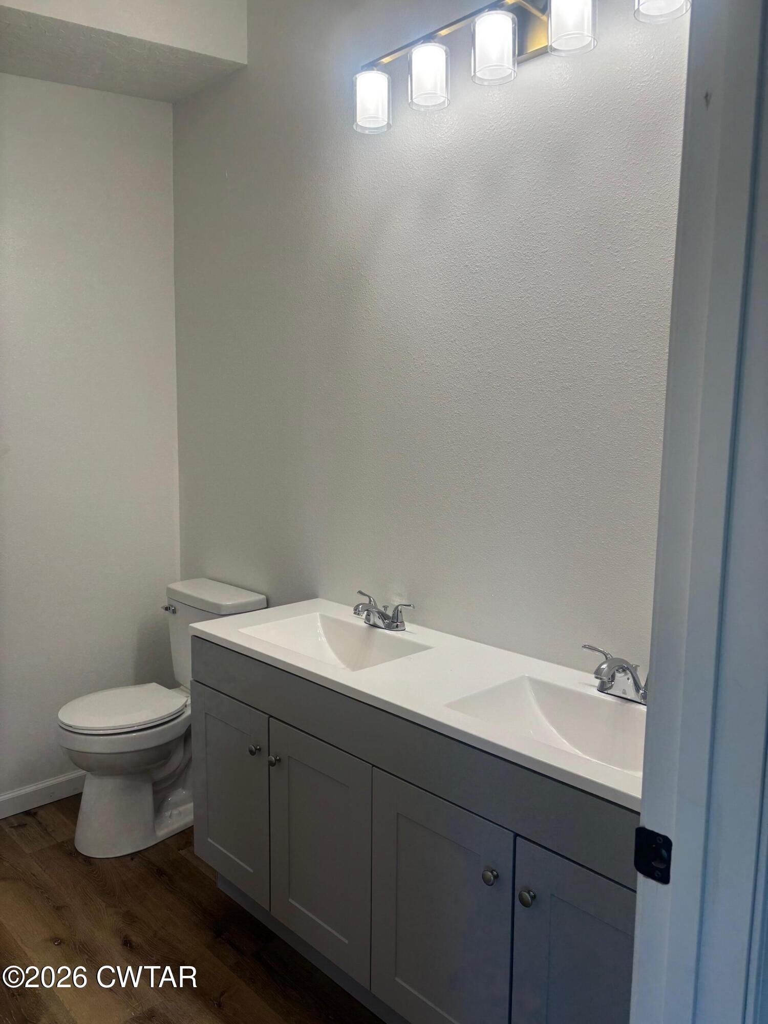 49 Primrose Drive Jackson, TN 38305 - Photo 18 of 20 a bathroom with a sink and a toilet