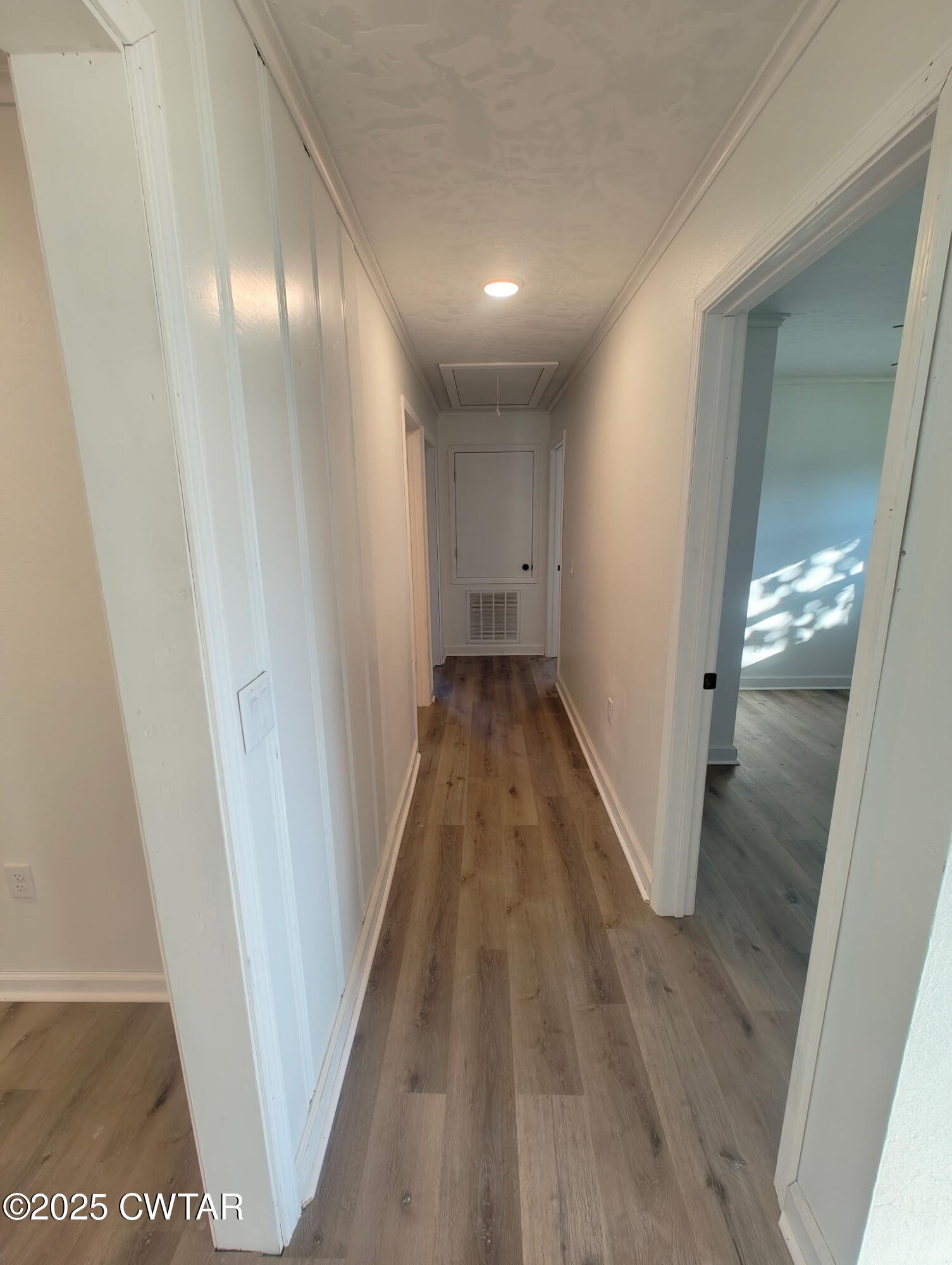 49 Primrose Drive Jackson, TN 38305 - Photo 4 of 20 a view of a hallway with wooden floor