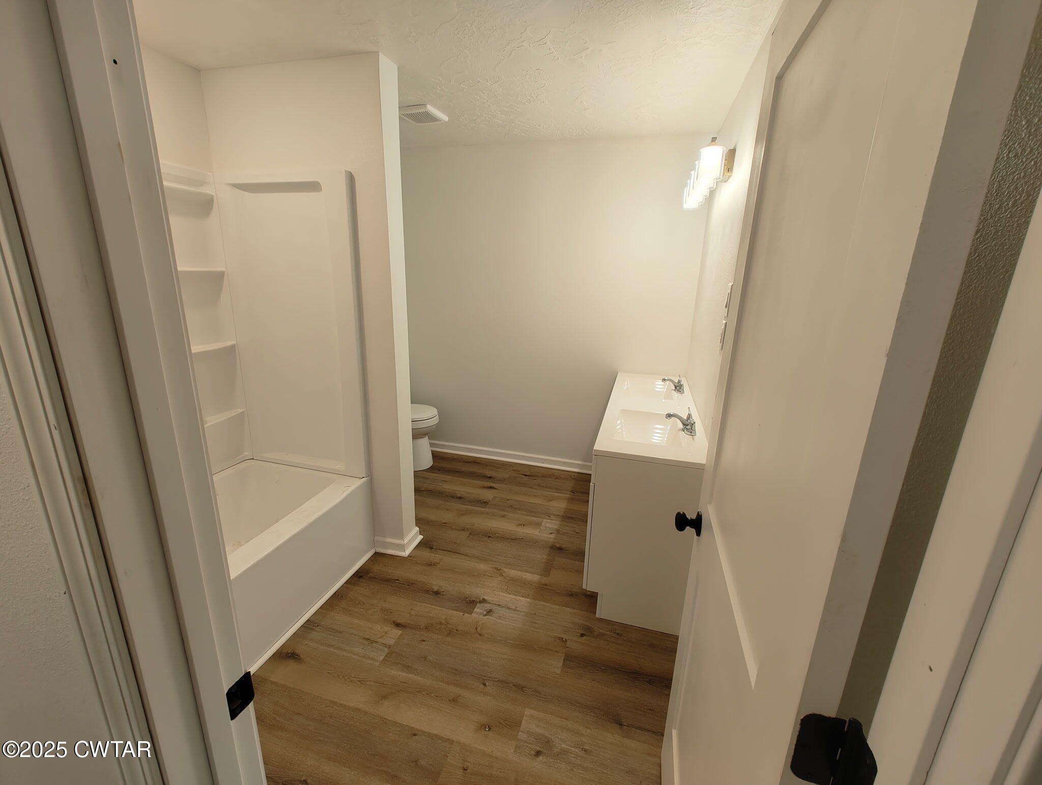 49 Primrose Drive Jackson, TN 38305 - Photo 5 of 20 a view of a bathroom from a hallway