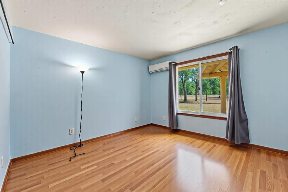 13185 Montecito Road Red Bluff, CA 96080 - Photo 17 of 36 a view of an empty room with glass door