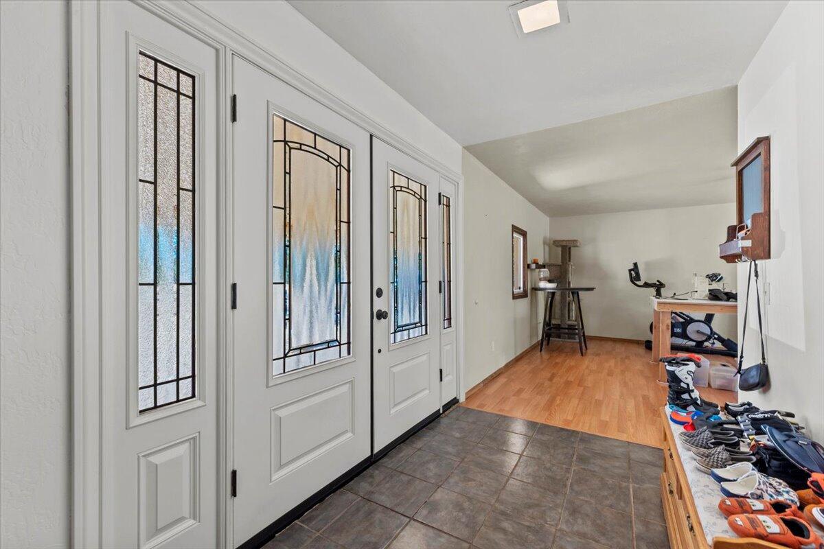 13185 Montecito Road Red Bluff, CA 96080 - Photo 2 of 36 a hallway with white doors and closet