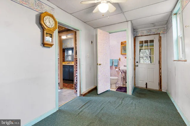 a view of an empty room and a window