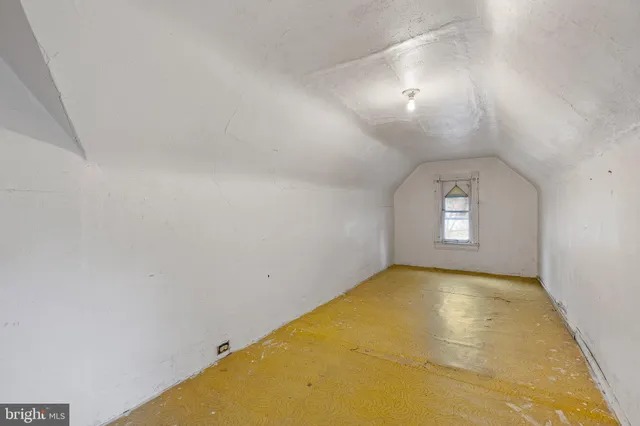 a view of a big room with windows