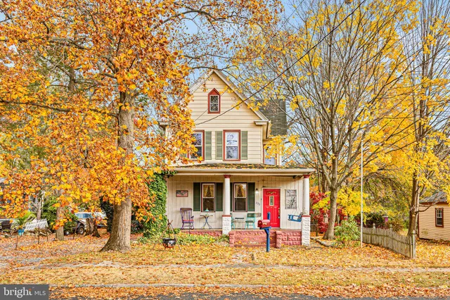 a kitchen with sink stove and cabinets