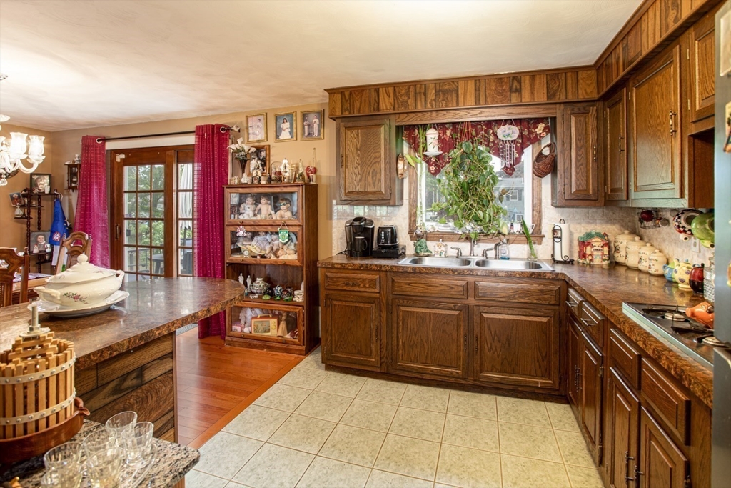 166 Stonehaven Road Fall River, MA 02723 - Photo 11 of 33 a kitchen with stainless steel appliances granite countertop a stove top oven