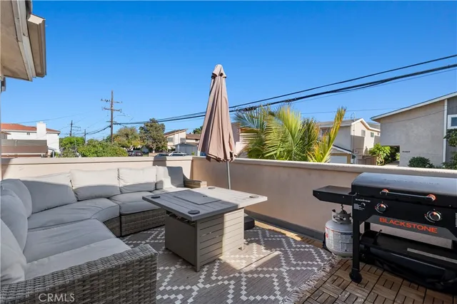 a living room with furniture a rug and a window