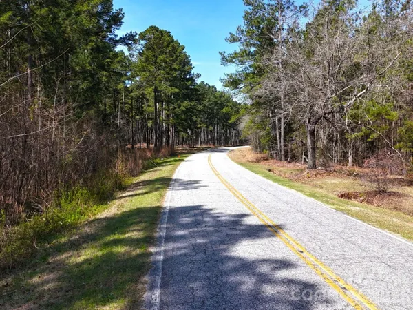 a view of swimming pool with a yard