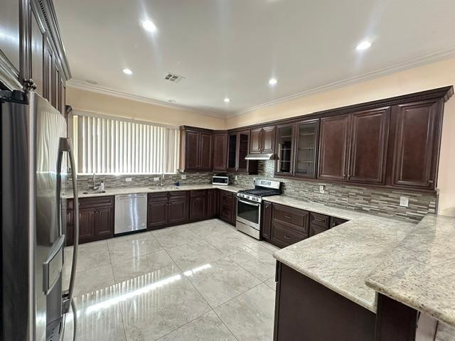 6830 North 14th Street Phoenix, AZ 85014 - Photo 1 of 28 a kitchen with stainless steel appliances granite countertop a sink stove and refrigerator