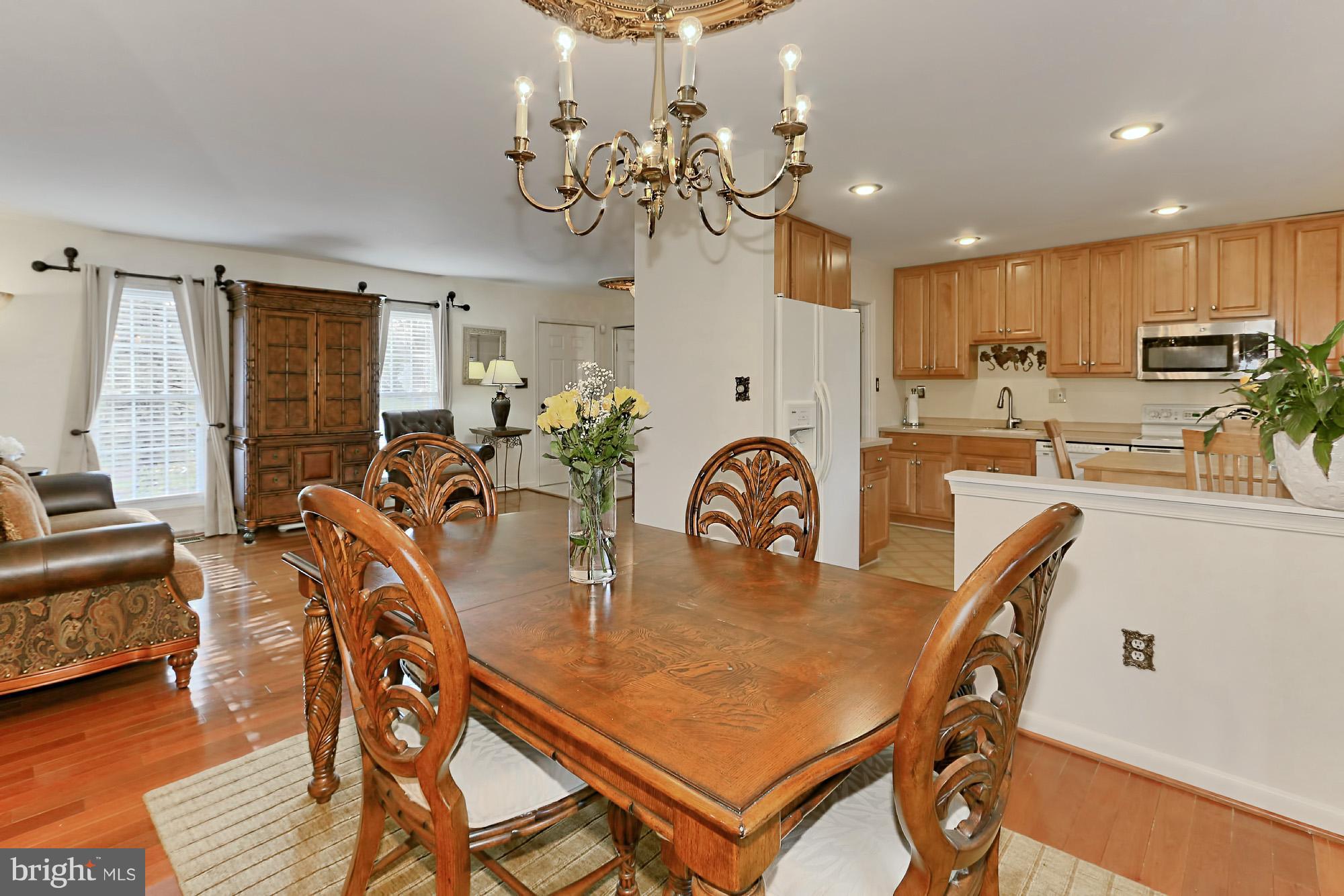 2340 Archdale Road Reston, VA 20191 - Photo 7 of 30 a view of a dining room with furniture and wooden floor