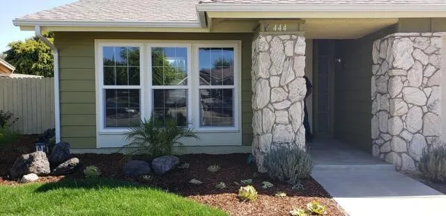 a front view of a house with a yard