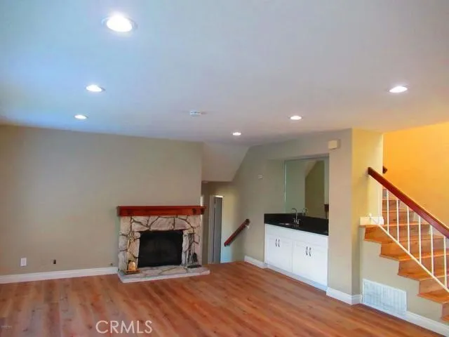 a view of an empty room and fire place