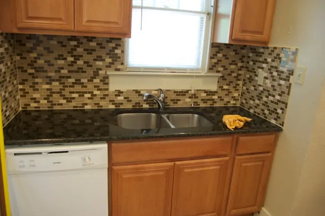 a kitchen with a sink and a window