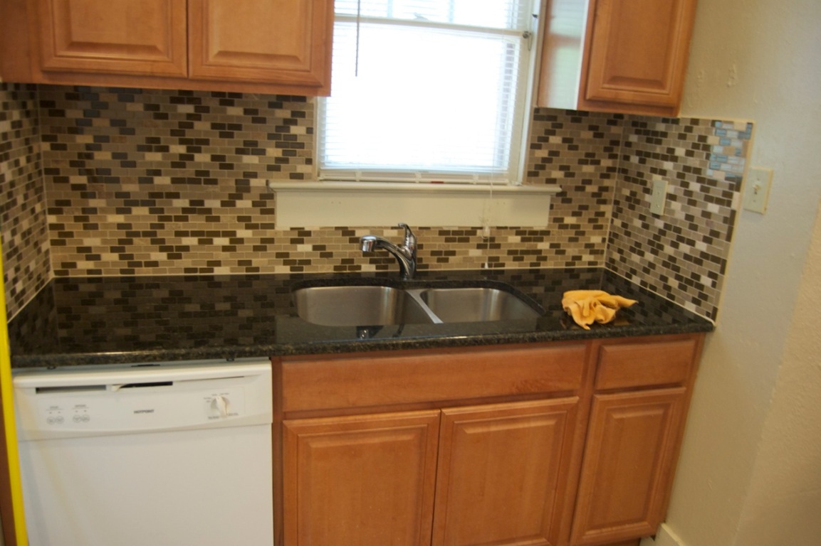 403 East 35th Street Austin, TX 78705 - Photo 8 of 14 a kitchen with a sink and a window