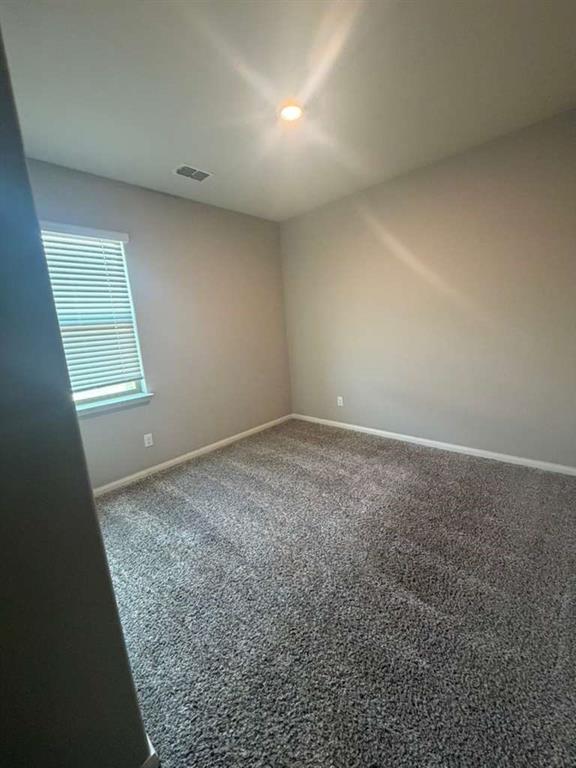 310 Foster Lane Anna, TX 75409 - Photo 11 of 15 Carpeted room featuring neutral wall tones, a recessed ceiling light, and a window with blinds