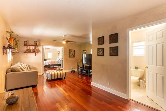 a view of a house with swimming pool and a yard
