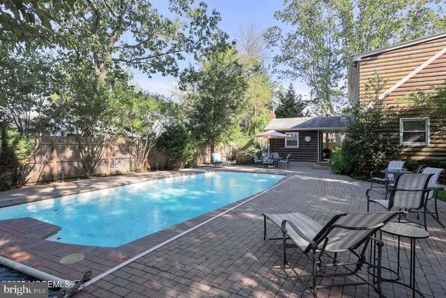 a view of a backyard with sitting area