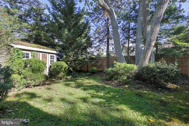 a view of a house with a yard and plants