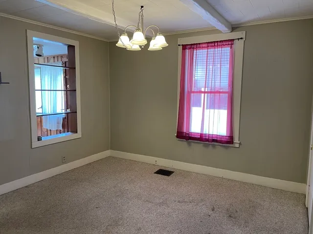a view of a windows and chandelier in a room