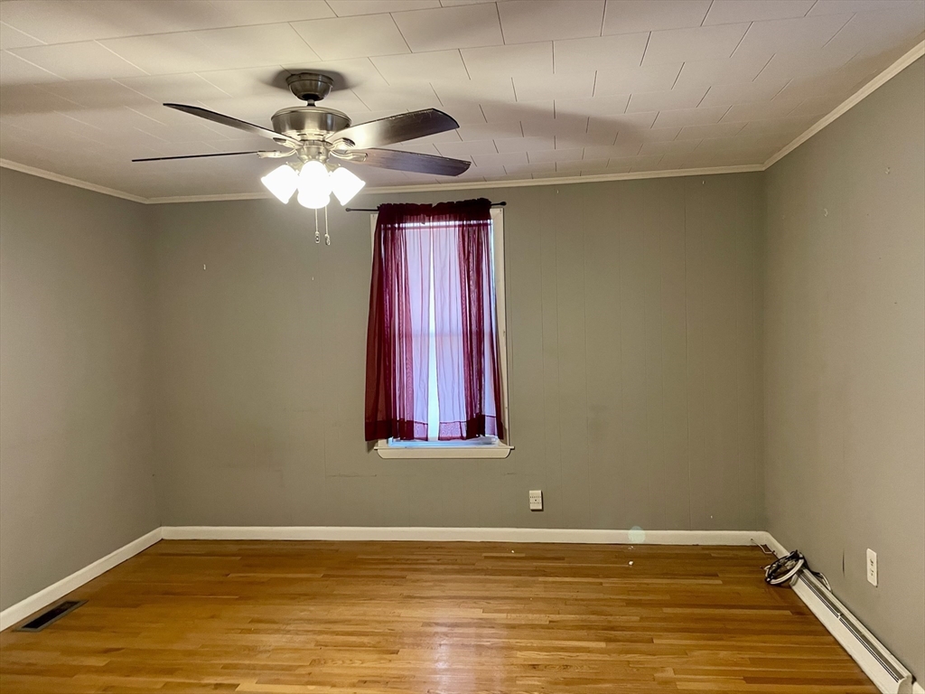 15 Green Street Reading, MA 01867 - Photo 16 of 34 a view of a room with window and wooden floor