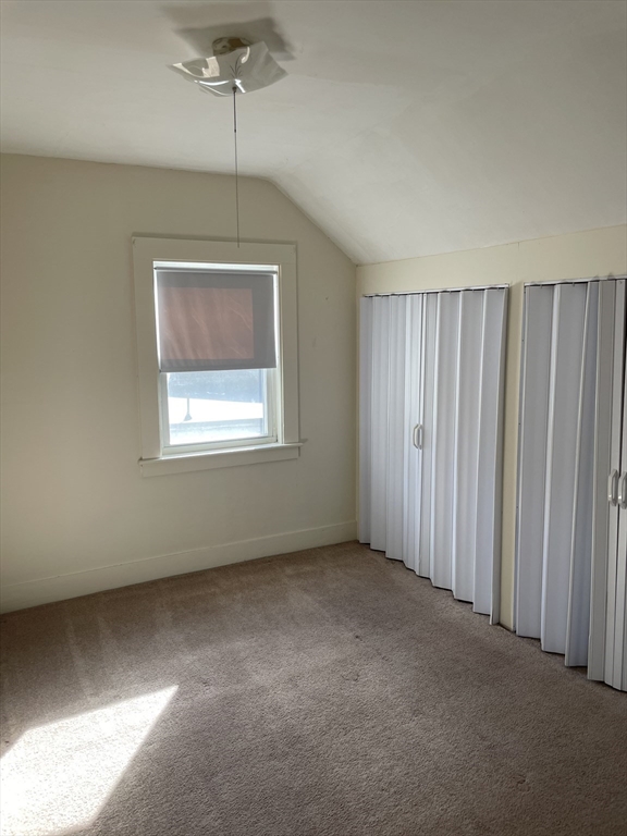 15 Green Street Reading, MA 01867 - Photo 22 of 34 a view of an empty room with a window