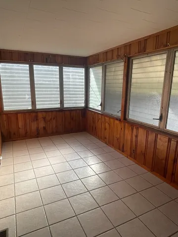 a room with window and cabinet