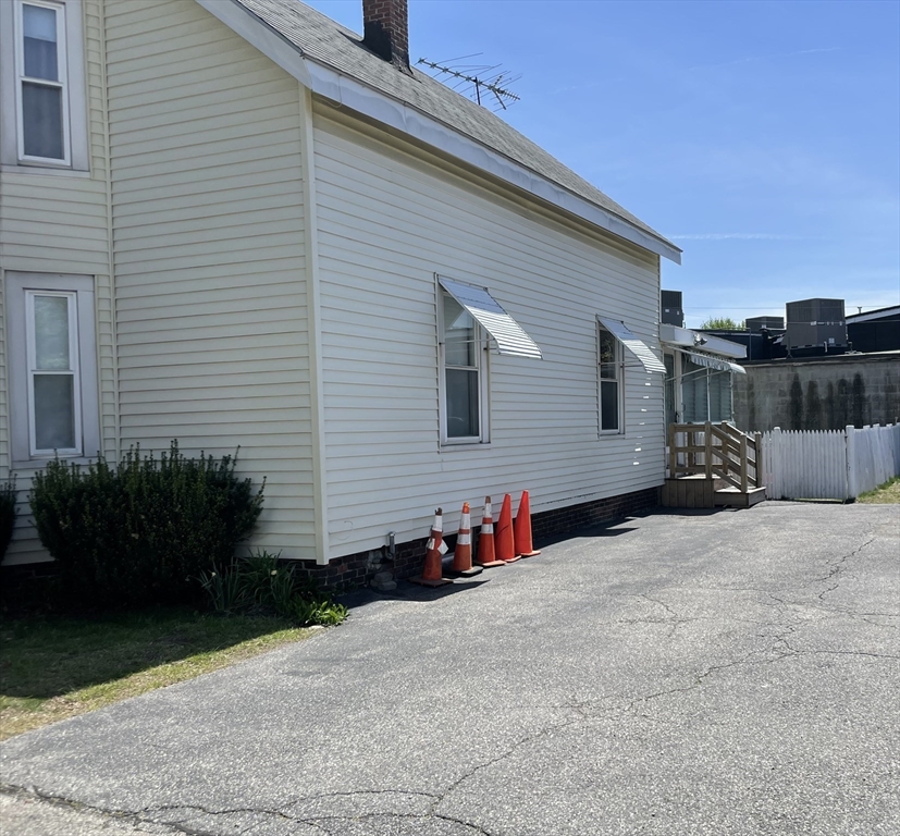 15 Green Street Reading, MA 01867 - Photo 3 of 34 a backyard of a house with potted plants