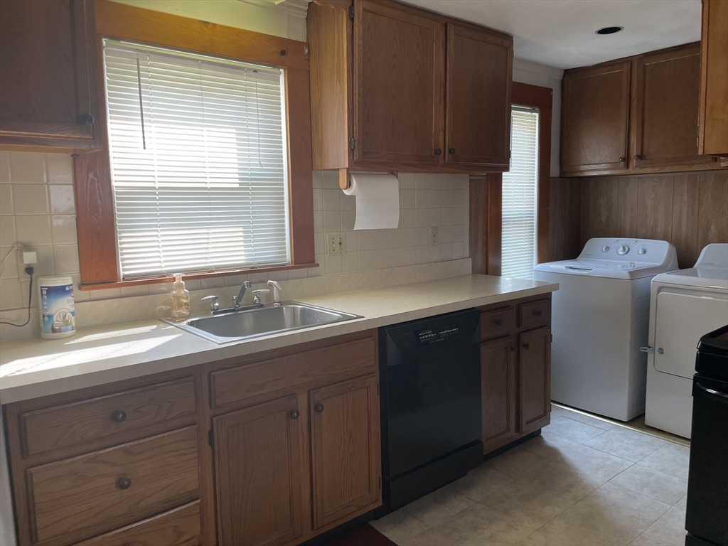 15 Green Street Reading, MA 01867 - Photo 31 of 34 a kitchen with sink and cabinets