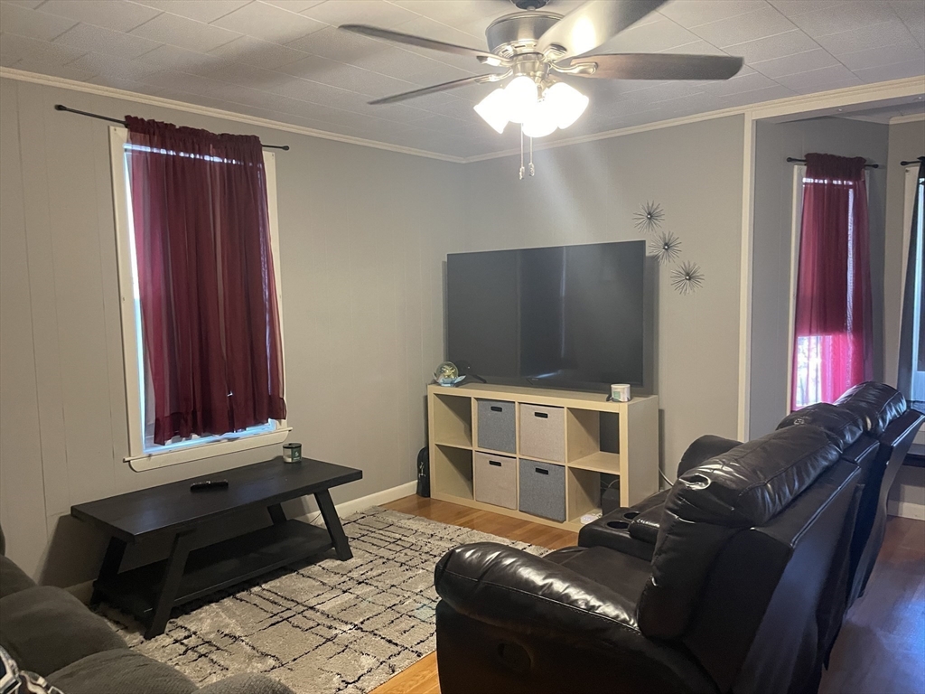 15 Green Street Reading, MA 01867 - Photo 32 of 34 a living room with furniture and a flat screen tv
