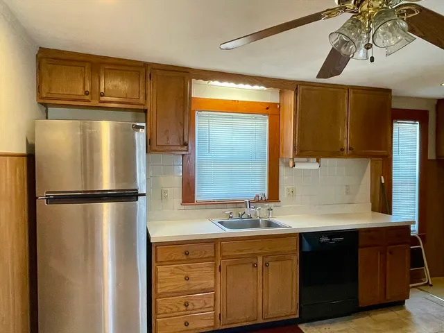 a kitchen with stainless steel appliances a refrigerator and a sink