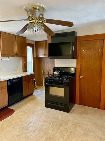 a kitchen with stainless steel appliances granite countertop a stove and a refrigerator