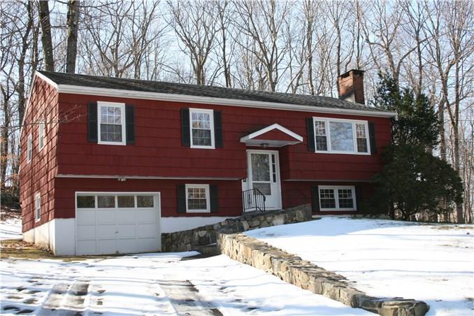 91 Sleepy Hollow Road Ridgefield, CT 06877 - Photo 1 of 1 a front view of a house with a yard