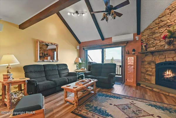 a living room with furniture and a table