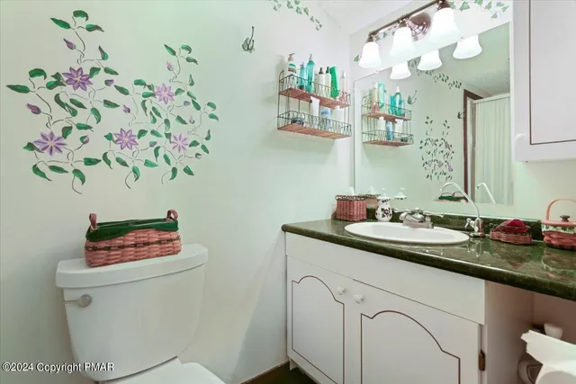 a bathroom with a toilet and a sink