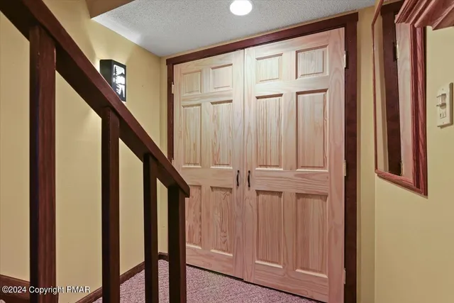 a view of a hallway with a couch