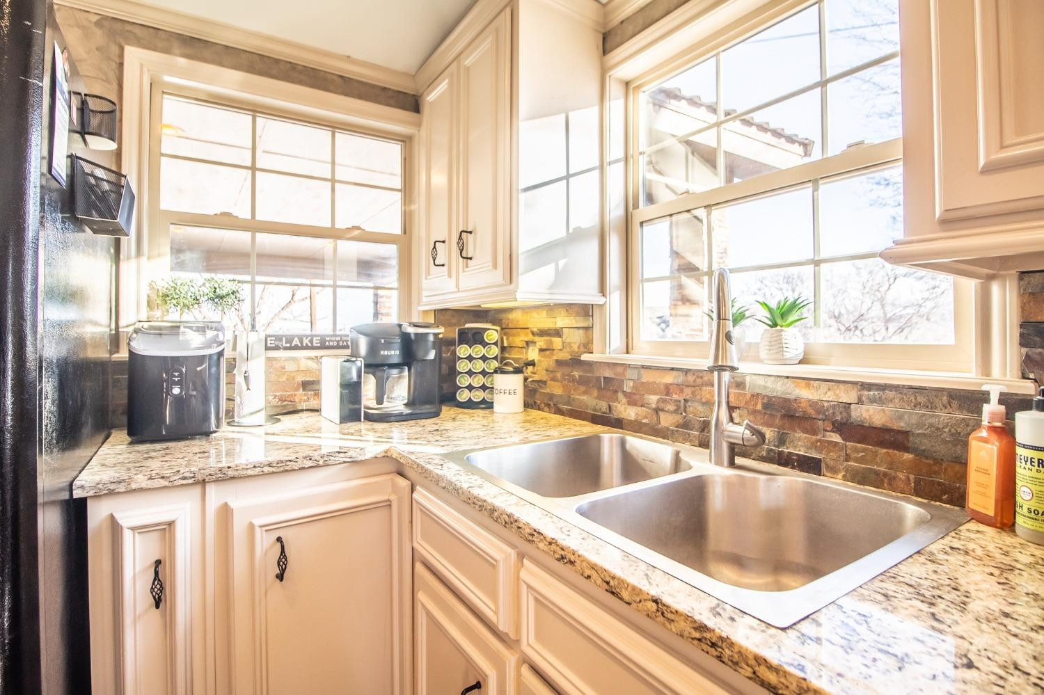 148 Pony Express Trail Lubbock, TX 79404 - Photo 11 of 29 a kitchen with a sink and a window