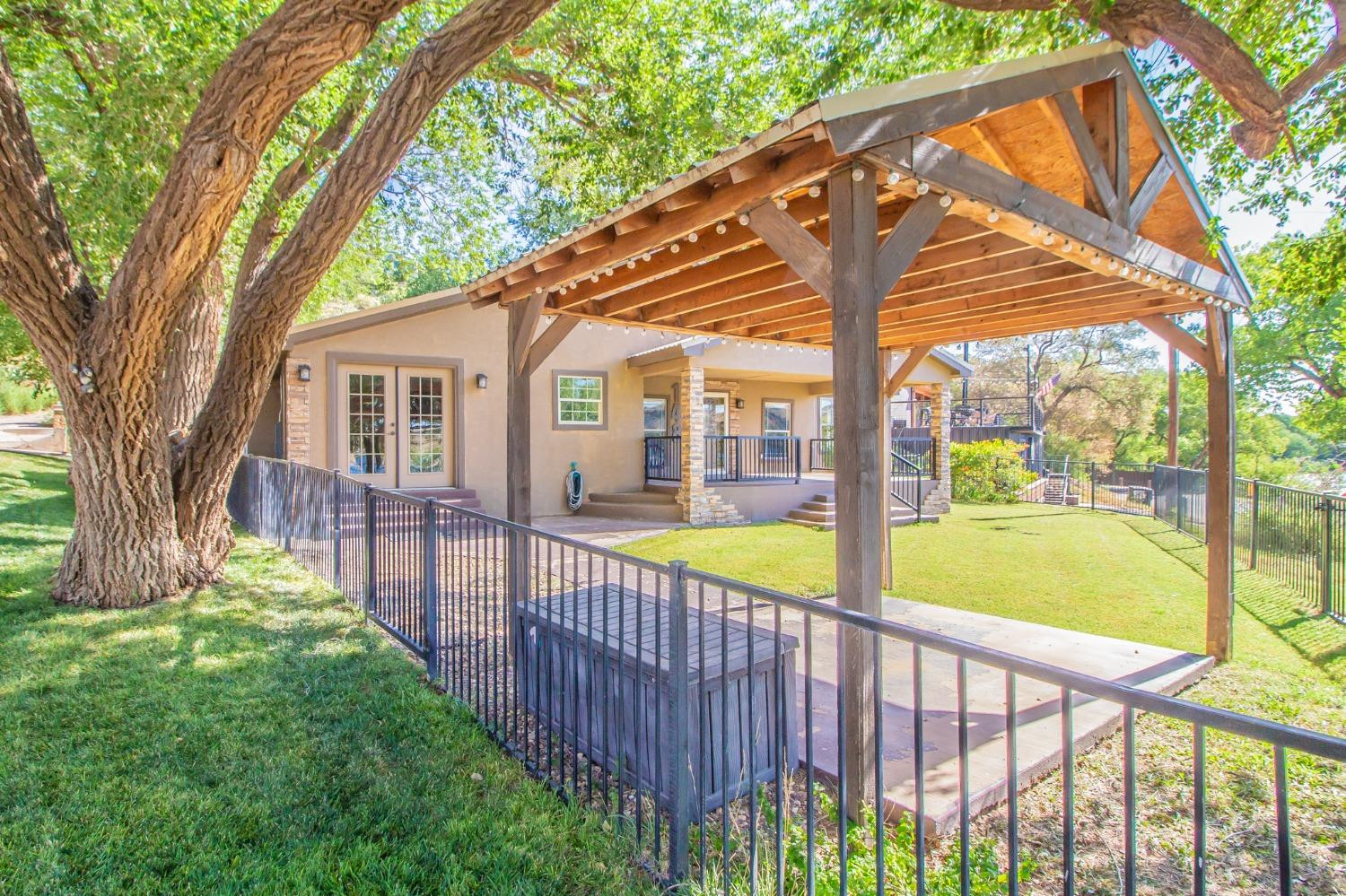 148 Pony Express Trail Lubbock, TX 79404 - Photo 25 of 29 a view of a house with backyard and a tree