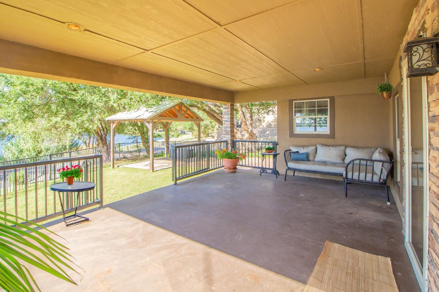 148 Pony Express Trail Lubbock, TX 79404 - Photo 27 of 29 a view of a porch with furniture and floor to ceiling window