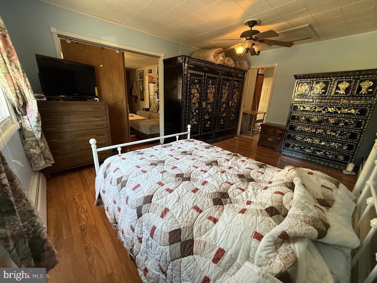 111 Huckleberry Lane Browns Mills, NJ 08015 - Photo 11 of 28 a bedroom with a bed dresser and flat screen tv